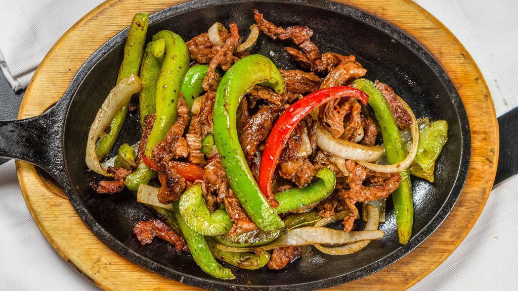 Beef Fajitas - Fajitas De Res · Marinated skirt steak, onion, red and green bell pepper. Served with rice and beans.
Guacamole and sour cream