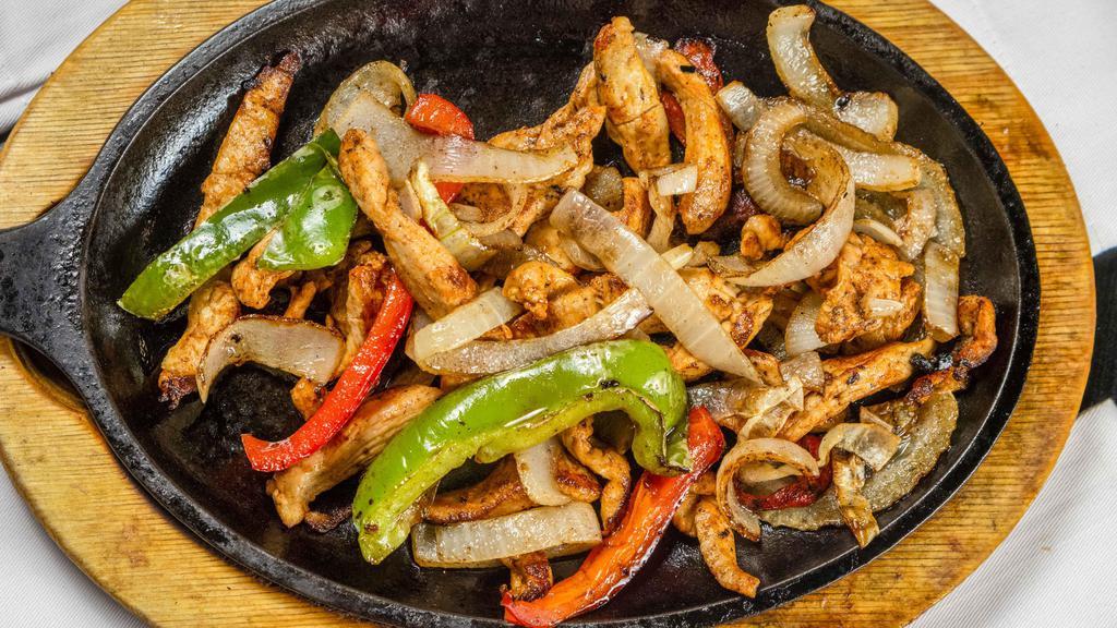 Chicken Fajitas · Marinated grilled chicken, onion, red and green bell pepper. Served with rice and beans.
Guacamole and sour cream