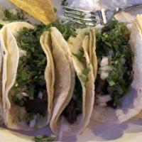 Margaritas Tacos · Three tacos tacos served with rice and beans.