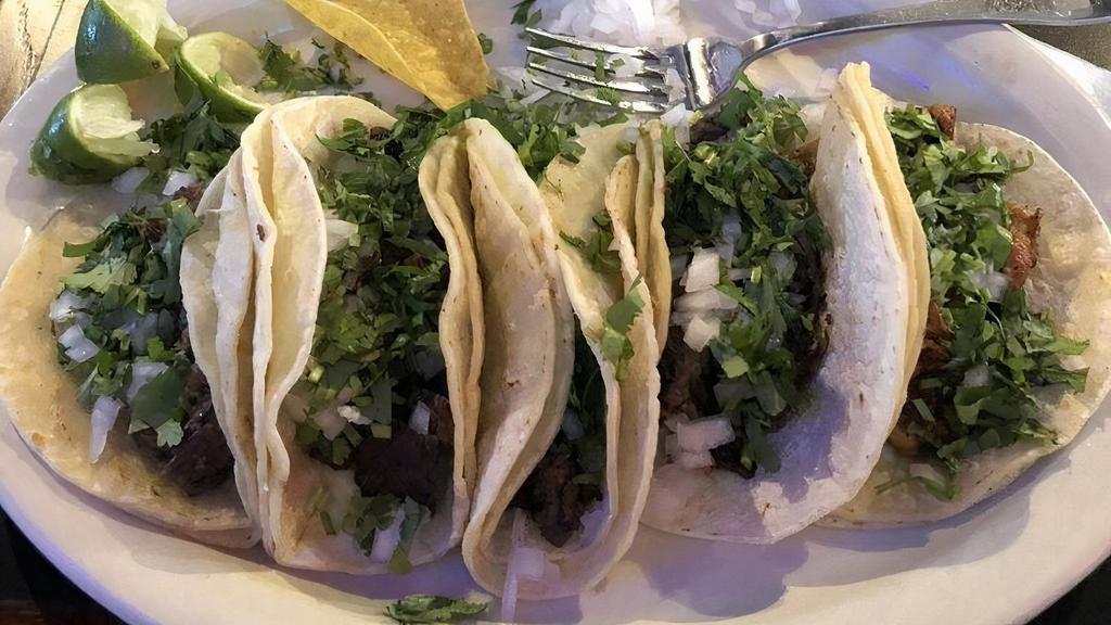 Margaritas Tacos · Three tacos tacos served with rice and beans.