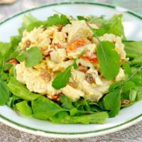 California Chicken Salad · Grilled chicken, bleu cheese crumbles, candied walnuts, fresh ripe strawberries, mandarin or...