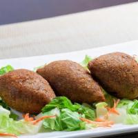 Kibbeh (3 Pieces) · Spiced ground beef, onions, and cracked wheat.