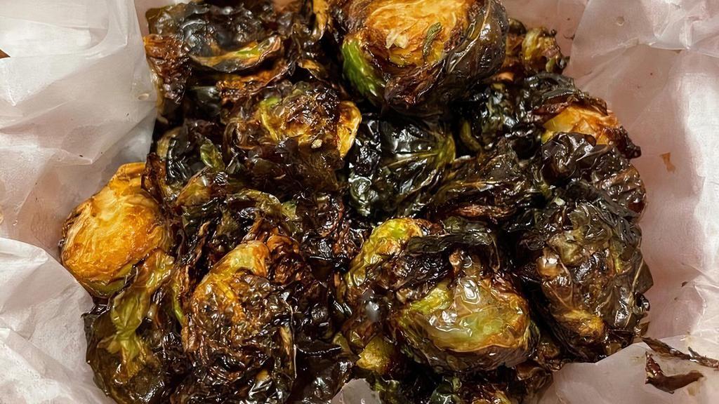 Crispy Brussels Sprouts · Gluten free, vegetarian. Favorite. Salted and finished with herbed honey.