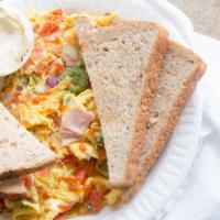 Western Omelette · Three eggs, peppers, onion, tomato, ham, and cheese.