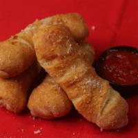 World Famous Pizza Rolls · 4 Pockets of goodness filled. with Mozzarella Cheese and Pepperoni.  You can now add toppings!
