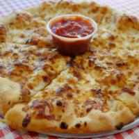 Cheesy Garlic Bread · A personal 10” dough topped with fresh garlic paste and mozzarella cheese cut into 6 slices....
