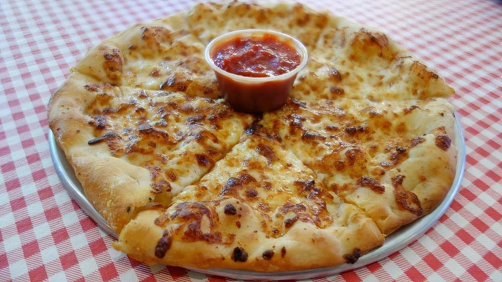 Cheesy Garlic Bread · A personal 10” dough topped with fresh garlic paste and mozzarella cheese cut into 6 slices. Served with our House Marinara Sauce. >> Please add any special requests below