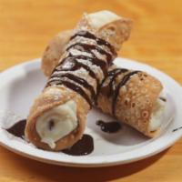Cannoli · An Italian tradition! Two Shells filled with Sweet Ricotta Cream and Chocolate Chip.