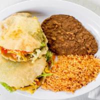 Gorditas · Two golden-fried gorditas filled with beef, chicken or carne guisada.