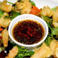 Popcorn Shrimp · Bite sized pieces of shrimp that have been deep fried.