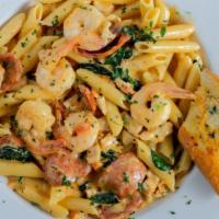 Mardi Gras Pasta · Penne pasta, andouille sausage, shrimp, chicken, tomato, spinach and Cajun cream.