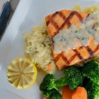 Grilled Salmon · Mixed vegetables, rice and blanc sauce.