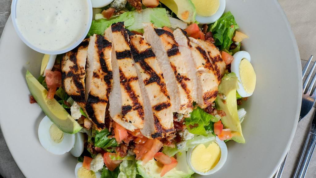Cobb Salad · Grilled chicken, romaine, hard-boiled egg, avocado, tomatoes, bacon and bleu cheese crumbles.