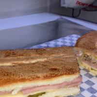 Original Cuban Sandwich · The fine flavor of the Cuban sandwich in Texas size. Cuban style roasted pork, ham, Swiss ch...