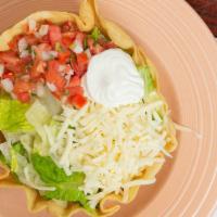 Taco Salad · Crispy flour tortilla bowl filled with a tossed green salad, cheese, pico de gallo, sour cre...