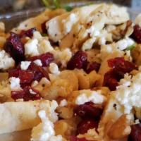 Cranberry Walnut Salad · Cranberry walnut salad is served with baby spinach, walnuts, grilled chicken, feta cheese, d...