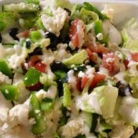 Greek Salad · Greek salad is served with romaine lettuce, tomatoes, green peppers, black olives, onions, c...