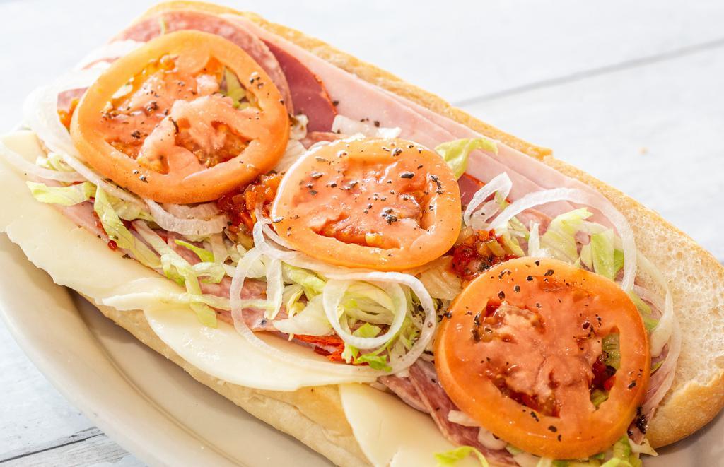 Knuckle Sandwich · Our signature Italian hoagie features imported ham, Genoa salami, capicola, and sharp provolone. Includes lettuce, tomato, onion, olive oil, and vinegar dressing and hot chopped cherry peppers.