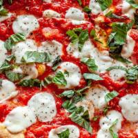 Classic Pizza Margherita · Fresh mozzarella, olive oil, crushed plum tomatoes, and fresh basil.