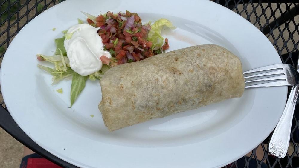 Burritos · A fresh soft flour tortilla burrito served with rice, beans, lettuce, pico de gallo, cheese and sour cream.