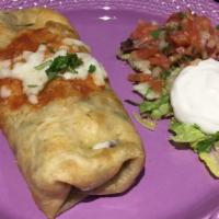 Chimichangas · A crispy chimichanga filled with rice, beans, cheese and served with sour cream and salad.