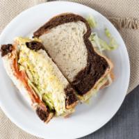 Egg Salad Sandwich · Sandwich made with Mayo, Mustard, Lettuce, Tomato, Onions. You are able to modify on choices...