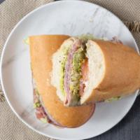 B Sub · Mortadella, salami, and prosciutto topped off with house-made pesto and provolone cheese all...