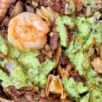 Surf & Turf Burrito · Asada and shrimp, rice, beans, onions, cilantro, guacamole and ricotta aioli.