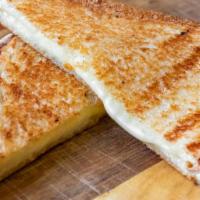 Grilled Cheese Sandwich · American cheese melted between two toasted slices of white bread.