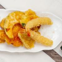Shrimp Tempura App · Lightly battered shrimp tempura & veggie served with side of warm tempura sauce.