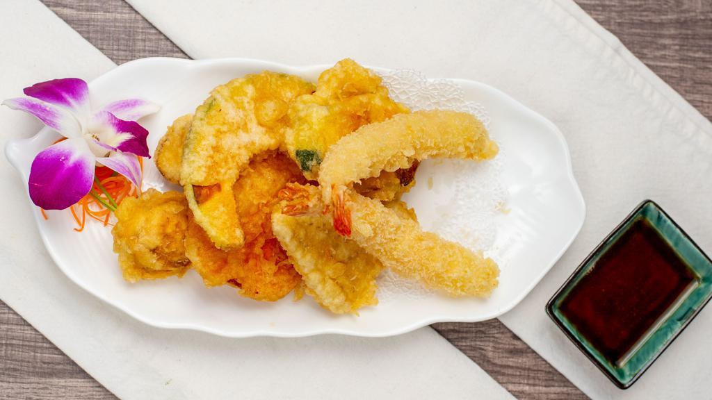 Shrimp Tempura App · Lightly battered shrimp tempura & veggie served with side of warm tempura sauce.