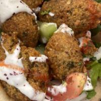 Falafel Sandwich · Vegetarian. Falafel is made of ground chickpeas and other spices, formed into a ball-like sh...
