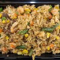Combo Fried Rice · Beef and pork and chicken and shrimp and mix vegetables with white rice.
