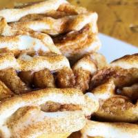 Cinnamon Roll · Three rolled pancakes with a cinnamon and brown sugar filling and topped with a decadent gla...