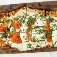 Margherita · Fresh mozzarella, tomatoes and fresh basil.