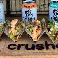 Shrimp Tacos · Trio of fresh shrimp tacos with a lemon chipotle aioli and fresh Pico de Gallo