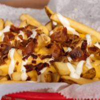 Wild Fries · Fries topped with cheese sauce, ranch, and real bacon bits.