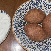 Kibbeh Mezze · Ground beef and bulgur dumplings, onion, almonds, and pine nuts.
