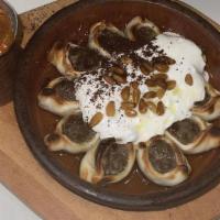 Manti · Mini ground beef dumplings topped with yogurt-cucumber and pine nuts served with a side of s...