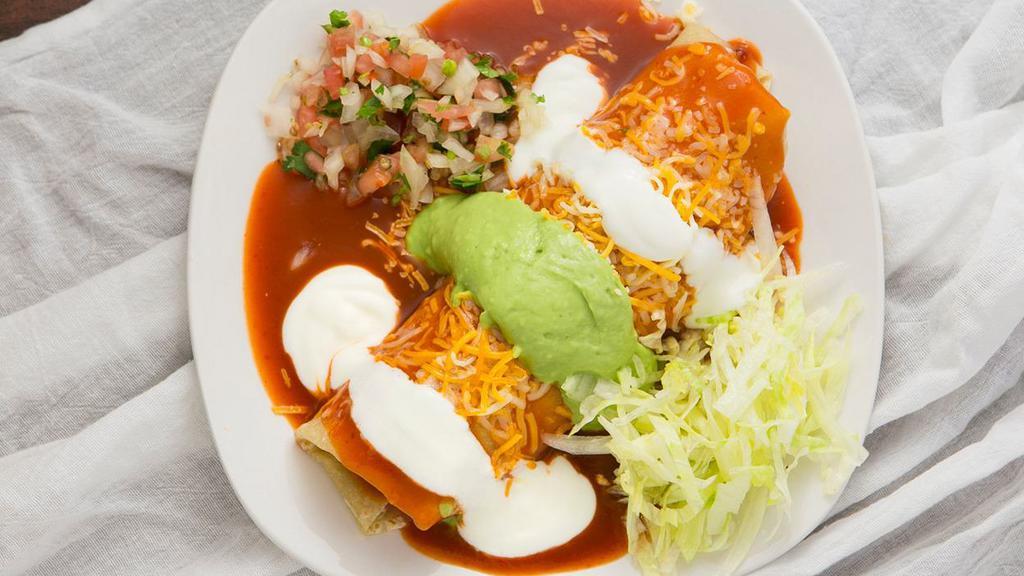 Asada  · Meat, beans and rice inside a burrito cover in red enchilada sauce with guacamole, sour cream and cheese on top. Served with pico de gallo and lettuce on the side