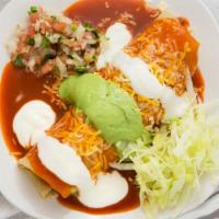 Al Pastor · Meat, beans and rice inside a burrito cover in red enchilada sauce with guacamole, sour crea...