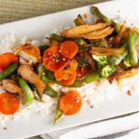 Chicken Teriyaki · Sliced chicken, broccoli, carrots, peppers, and onions over a bed of jasmine rice