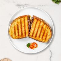 Russian Roulette Panini · Roasted beef, Munster cheese, caramelized onions, lettuce, plum tomatoes, and Russian dressi...