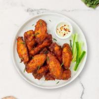 Ranch City Wings · Fresh chicken wings fried and tossed in classic ranch sauce. Served with your choice of dipp...