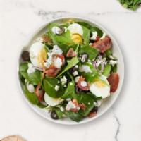Spinach Baby Salad · Bed of baby spinach with selected toppings.