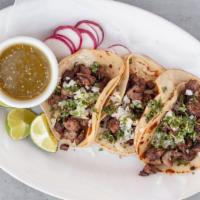 Taco Mexicanos · (3) street vendor style; meat-filled corn tortillas with onions, cilantro, lime wedge, radis...