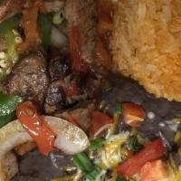 Alambre · Seared steak, baby shrimp, chorizo sausage with onions, peppers and Oaxaca cheese roasted in...