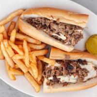 Philly Cheesesteak · Sautéed onions, mushrooms, choice of American or provolone on a long roll.