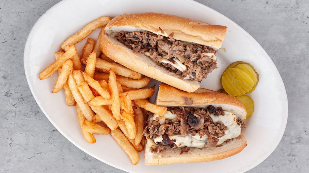 Philly Cheesesteak · Sautéed onions, mushrooms, choice of American or provolone on a long roll.