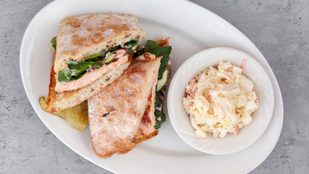 Grilled Salmon Ciabatta · Spinach, red onion, tomato, cucumbers, roasted sesame sauce, toasted roll.